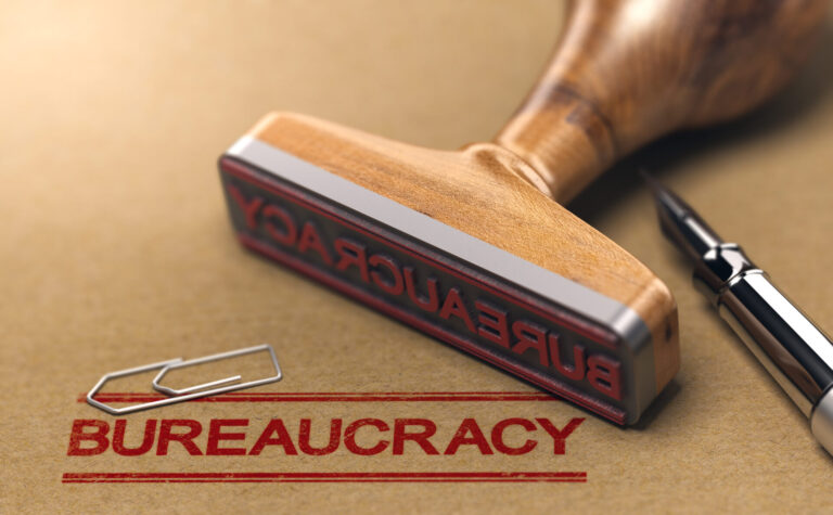 Bureaucracy,Words,Stamped,On,A,Brown,Paper,With,Rubber,Stamp